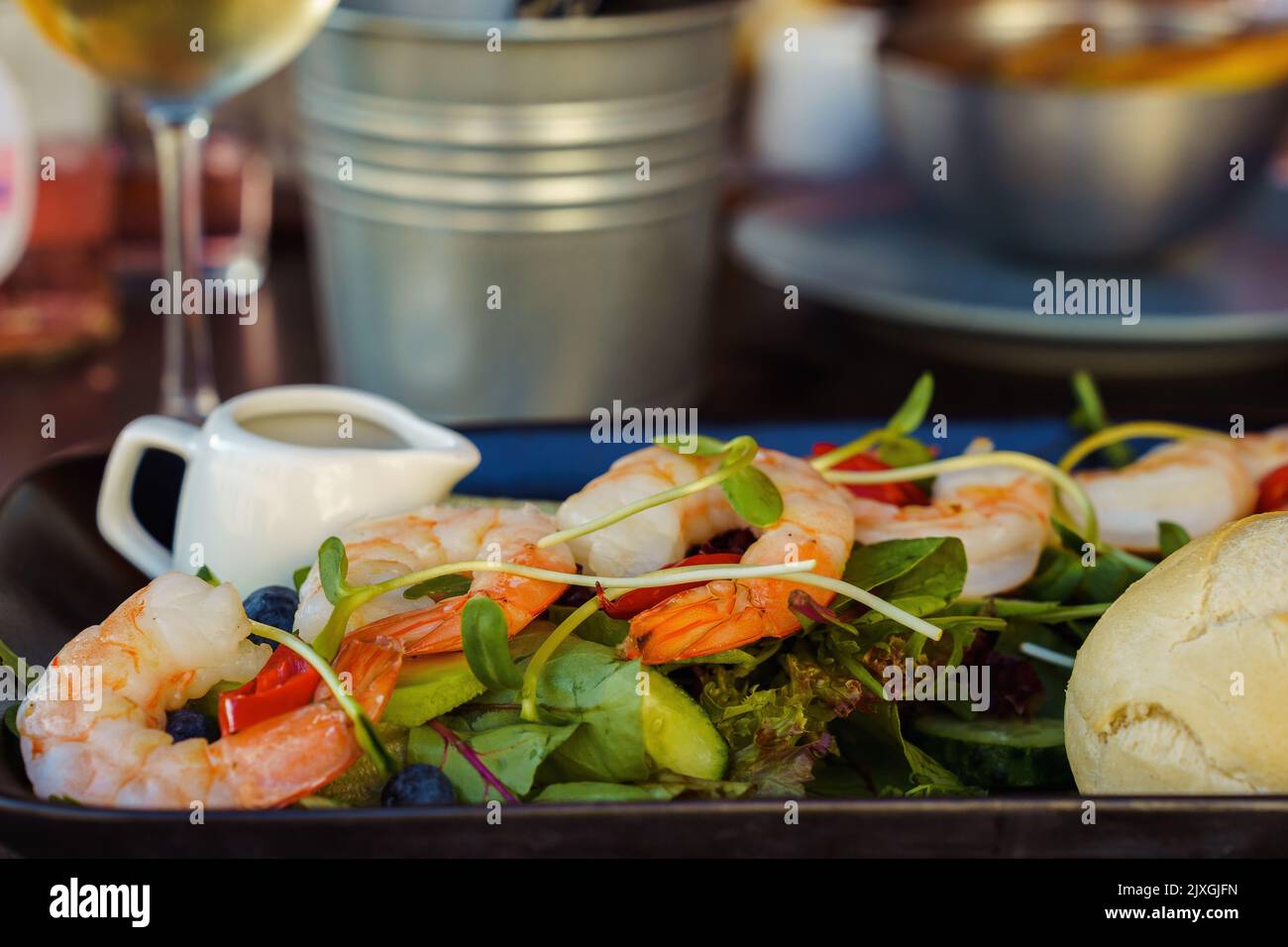 Shrimp salad on a table in a restaurant close-up. Healthy food. Stock Photo