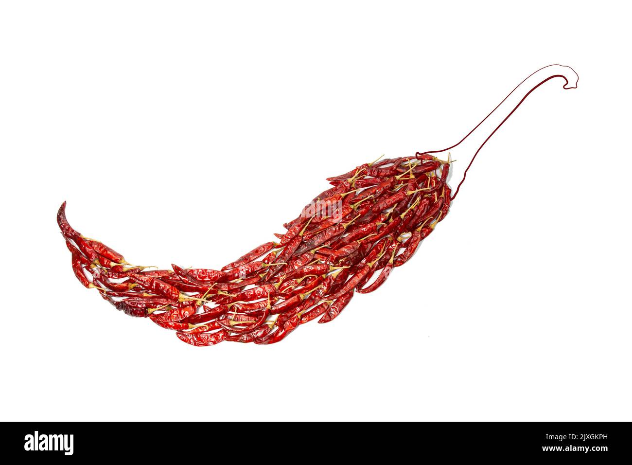 A giant chilli made by real dried red chilies or peppers. A collage idea, creative still life concept of peppers for explain extra hot in ad of other Stock Photo