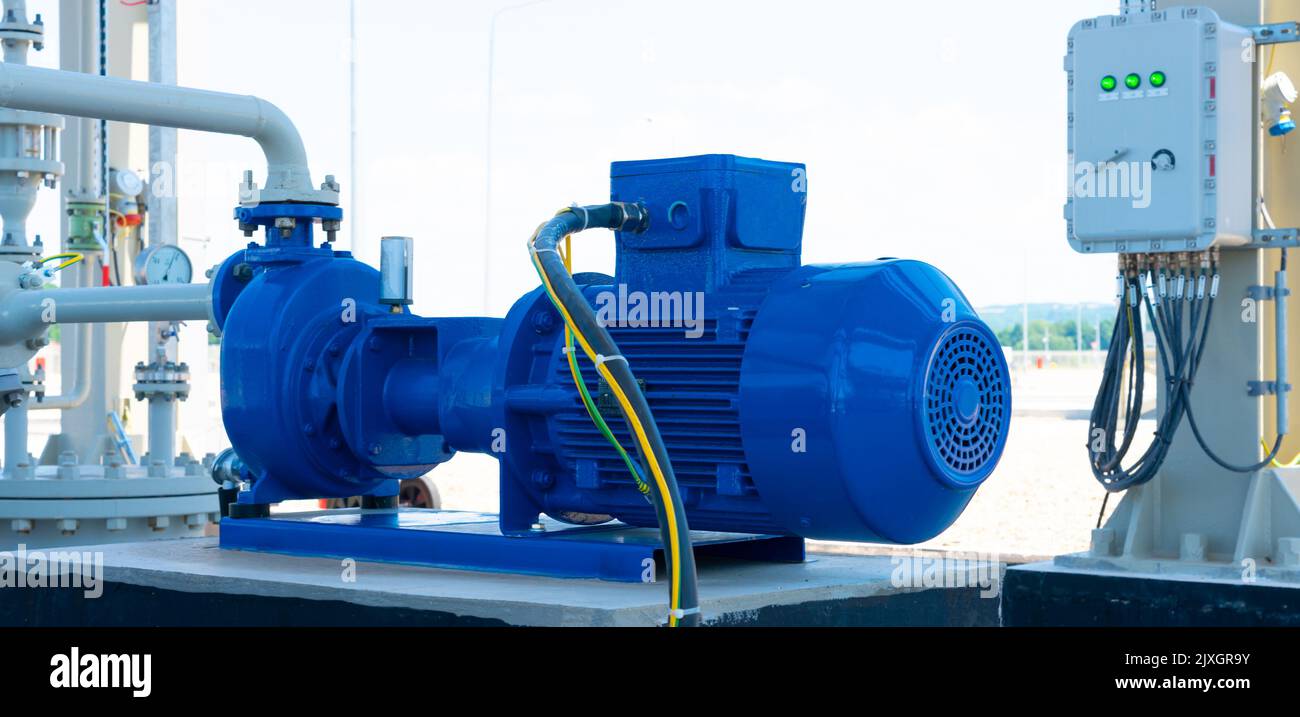 Blue electric water pump mounted on a concrete base Stock Photo Alamy