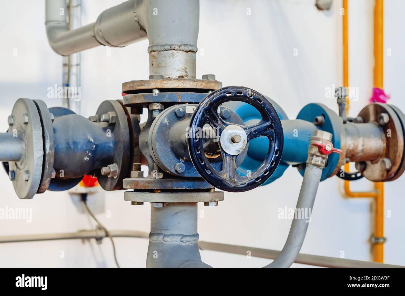 Metal pipes, pipe connections, taps. Industrial production Stock Photo
