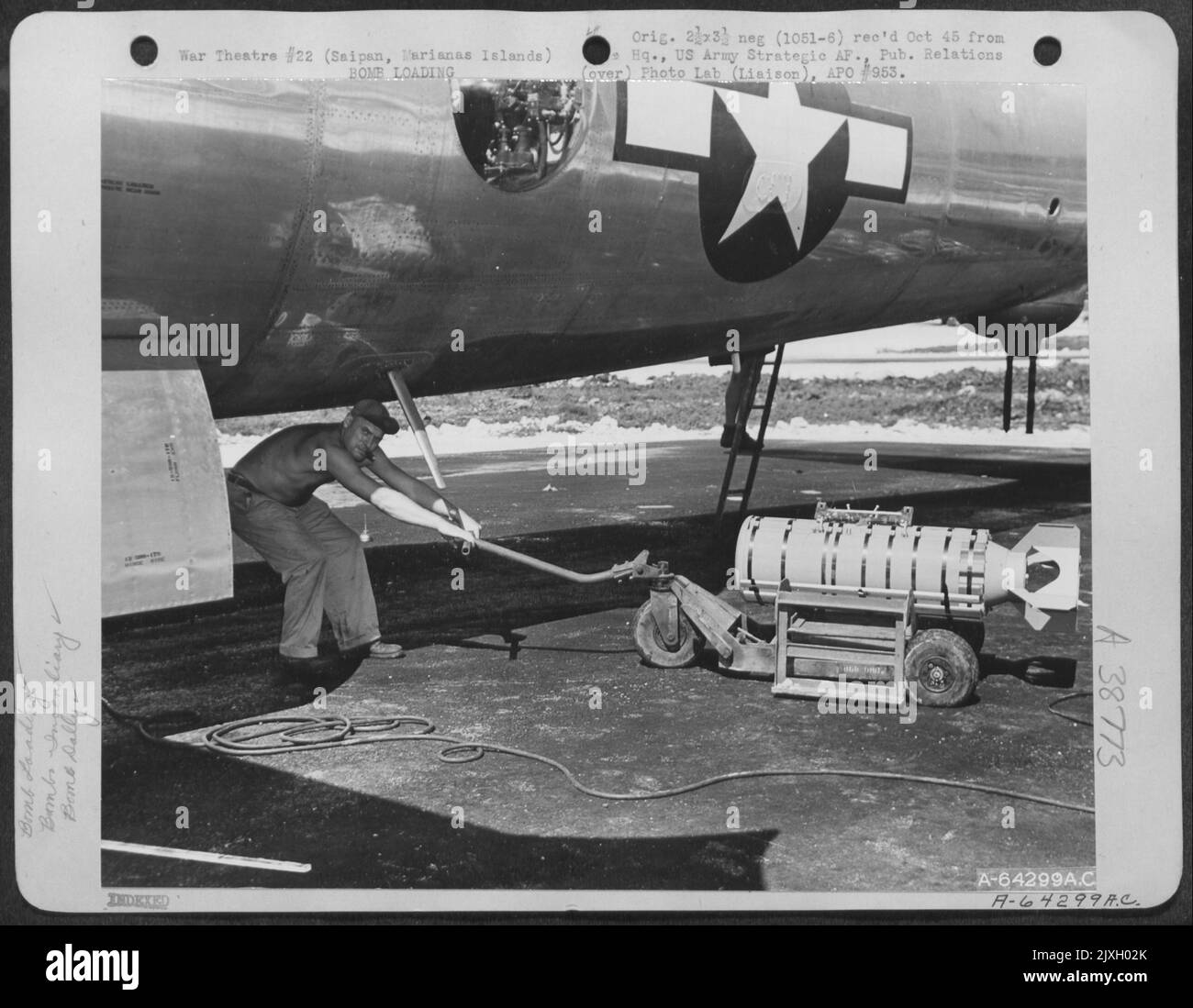 In Preparation For A Bombing Mission Over Tokyo, Japanesean, An Armorer ...