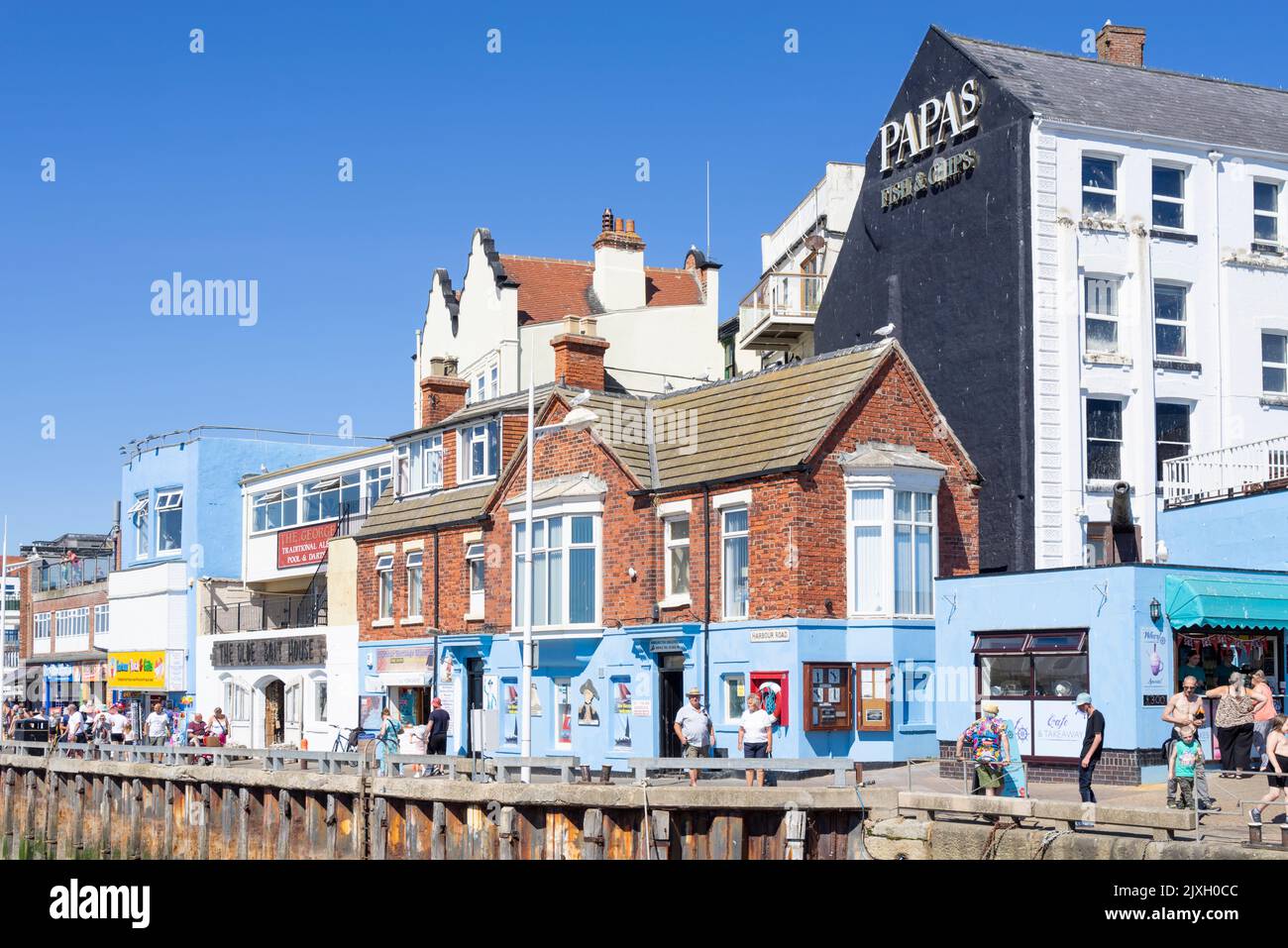 Bridlington Harbour wall with Papa's fish and chips restaurant Bridlington East Riding of Yorkshire England UK GB Europe Stock Photo