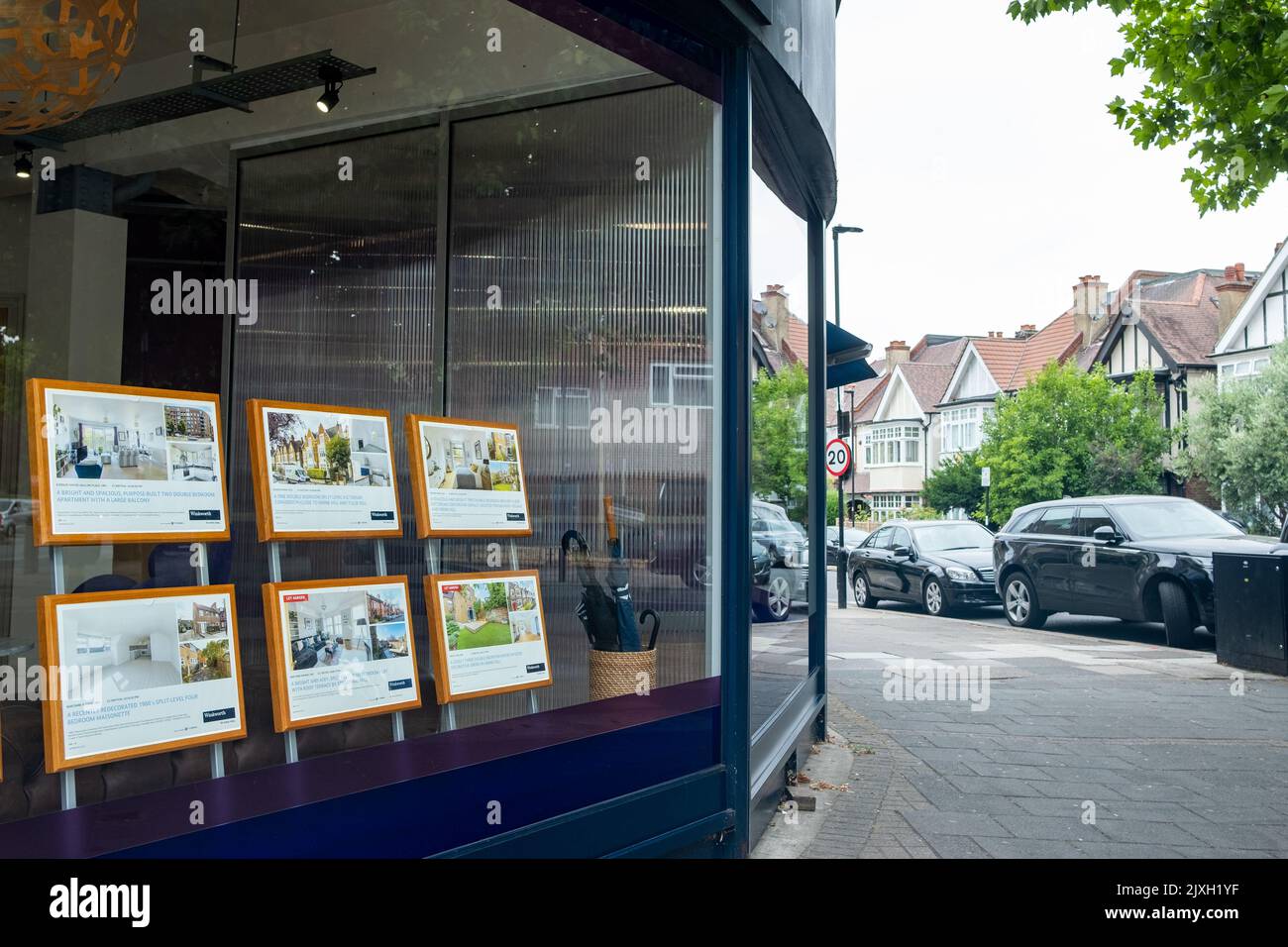 London- August 2022: An estate agent window on street of residential houses Stock Photo