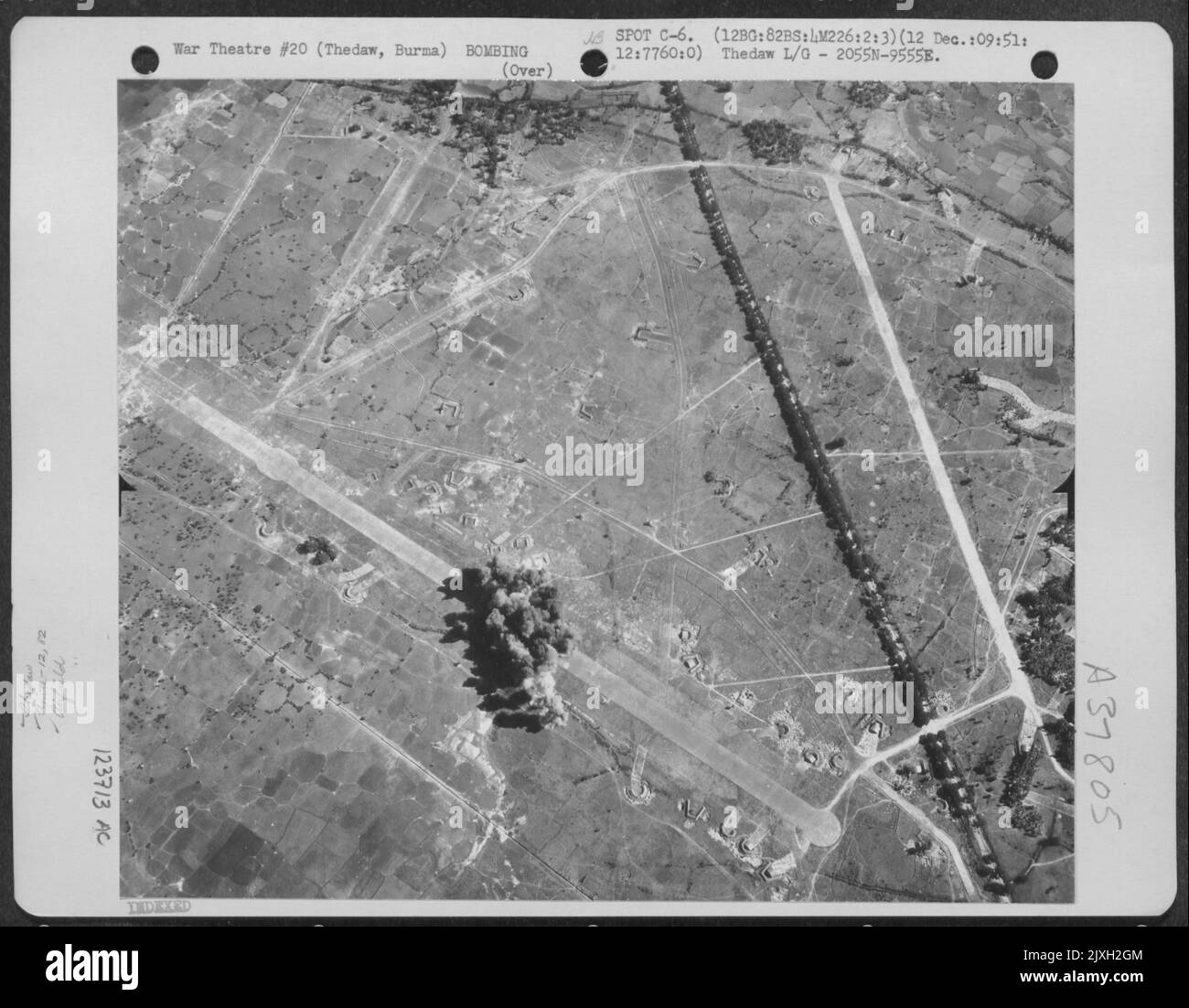 Bombs Burst In A Compact Cluster On Thedaw Landing Ground, Burma On 12