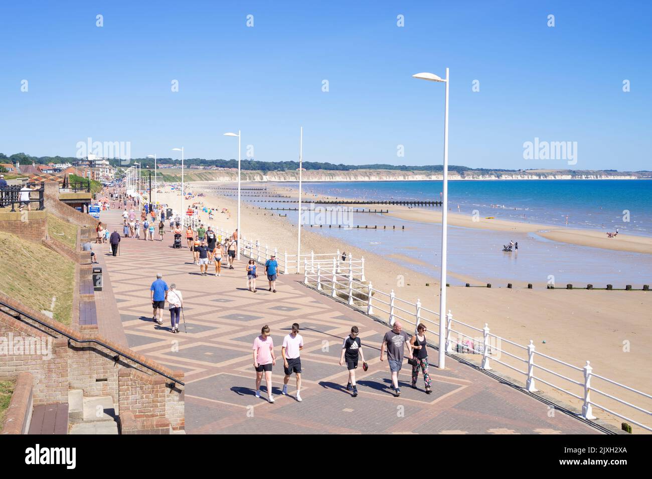 Bridlington People walking on North Marine drive connecting South Bridlington with North beach East Riding of Yorkshire England UK  Europe Stock Photo
