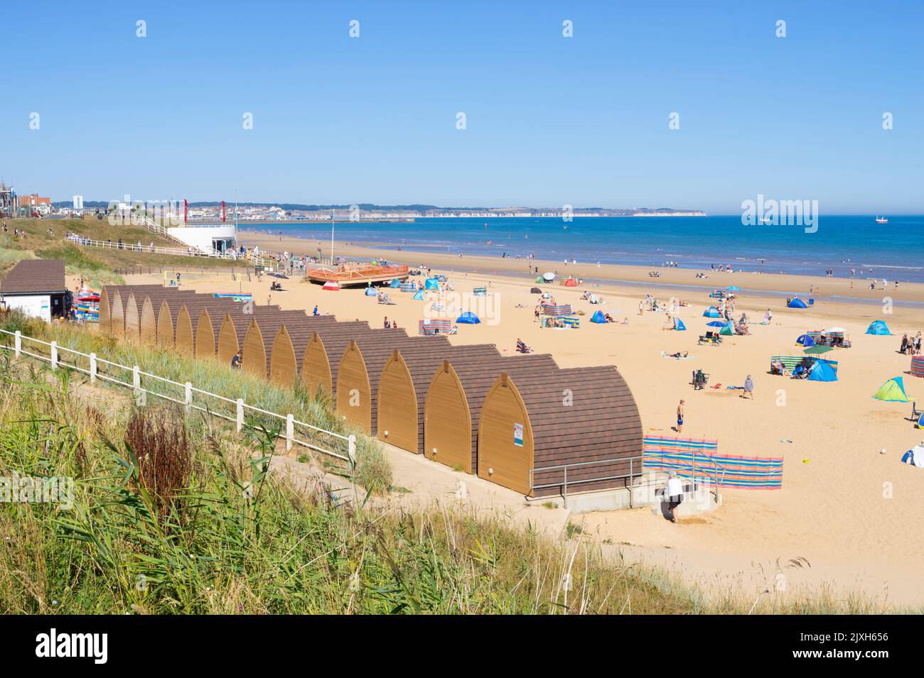 Bridlington Beach Yorkshire South beach huts tourists holidaymakers and people sunbathing on the beach at Bridlington Yorkshire England UK GB Europe Stock Photo