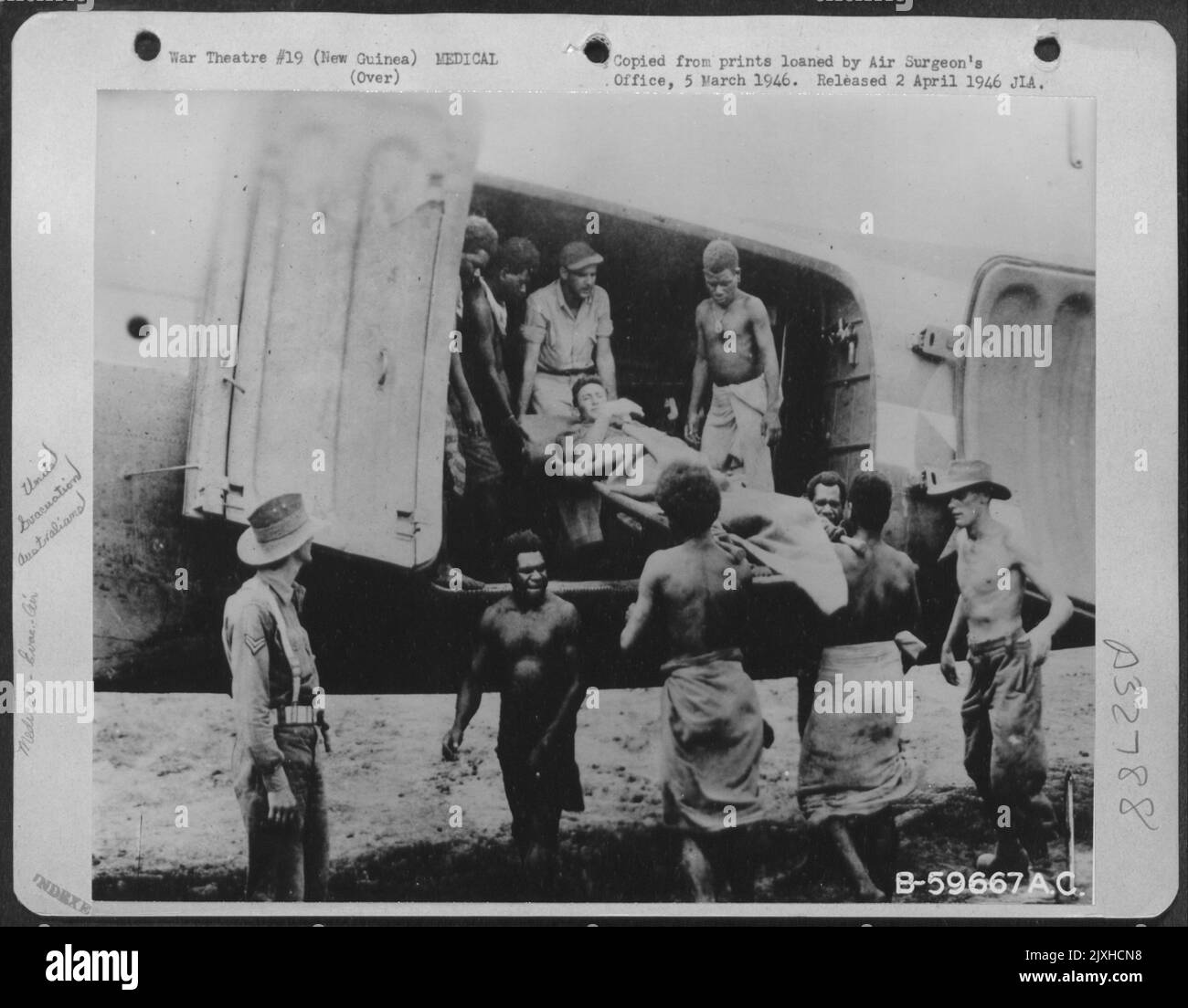 Native Litter Bearers Assisting Australians And American Soldier In