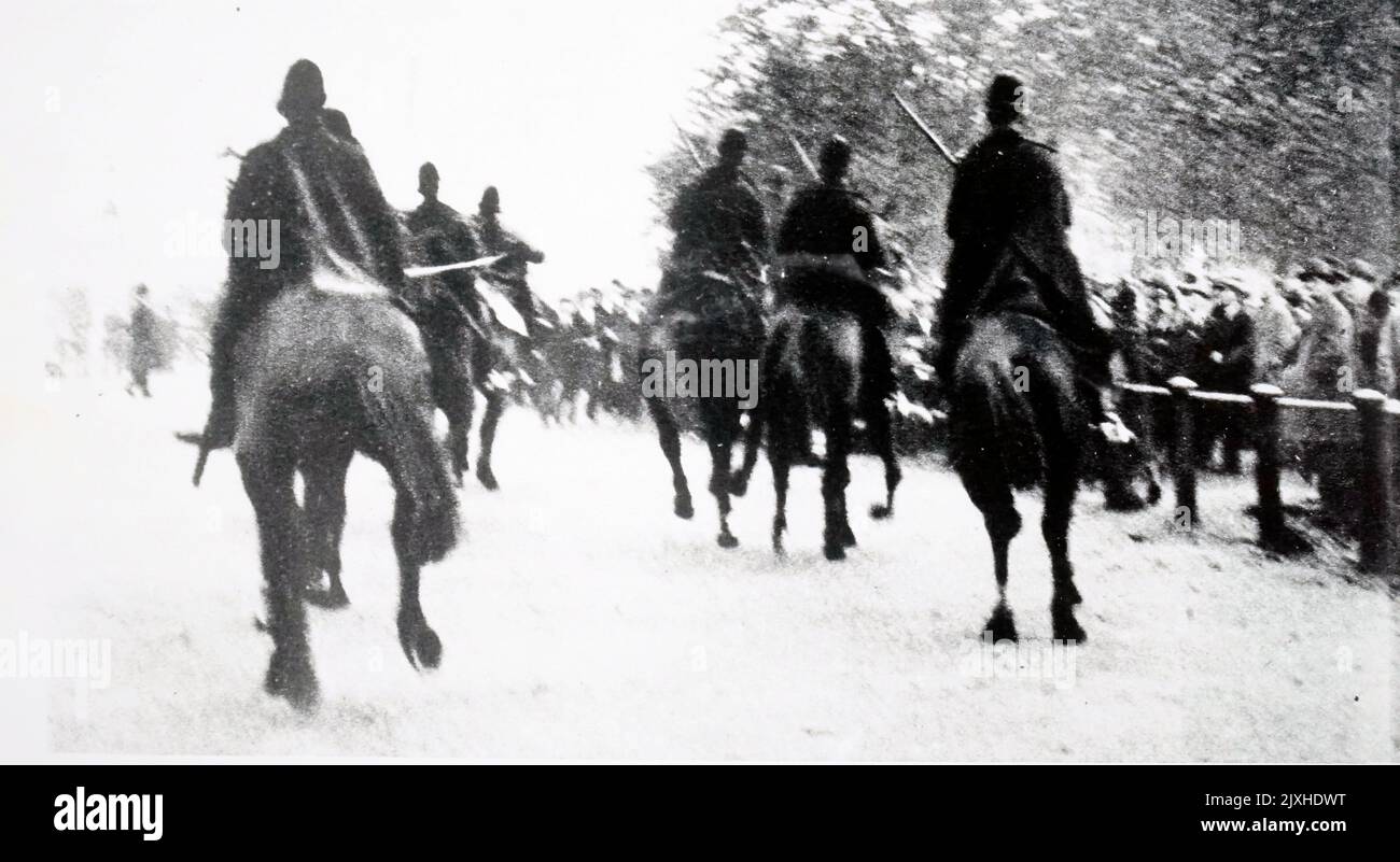 Photograph taken during the National Hunger March 1932 with mounted police ride through Hyde Park. Dated 20th Century Stock Photo