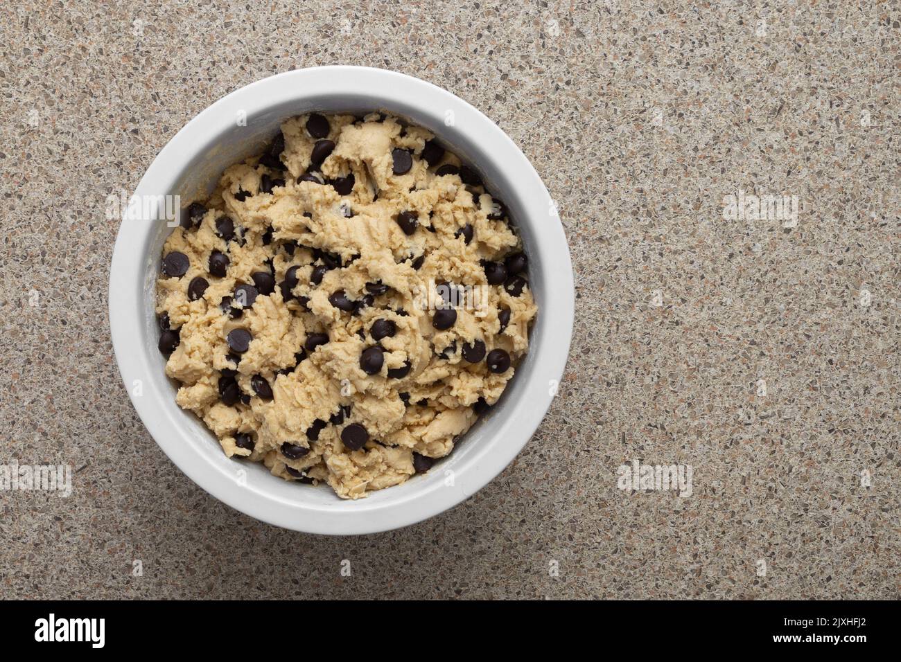 Chocolate chip cookie dough in mixing bowl with copy space Stock Photo