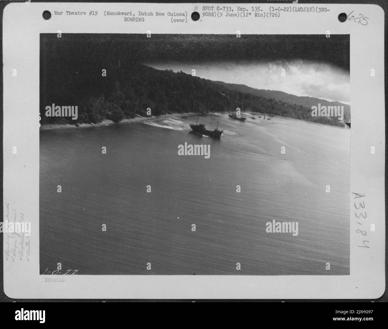 A Douglas A-20 of the 5th Air Force's 3rd Bombardment Group, 90th Bombardment Squadron flies mast-high over Japaneseanese ships at Manokwari, Dutch New Guinea during an attack on June 9, 1944. Stock Photo