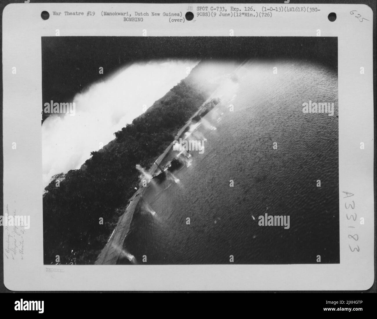 These Japaneseanese ships at Manokwari, Dutch New Guinea are the target of planes of the 5th Air Force's 3rd Bombardment Group, 90th Bombardment Squadron as they flew mast-high to carry out a mission on June 9, 1944. Stock Photo