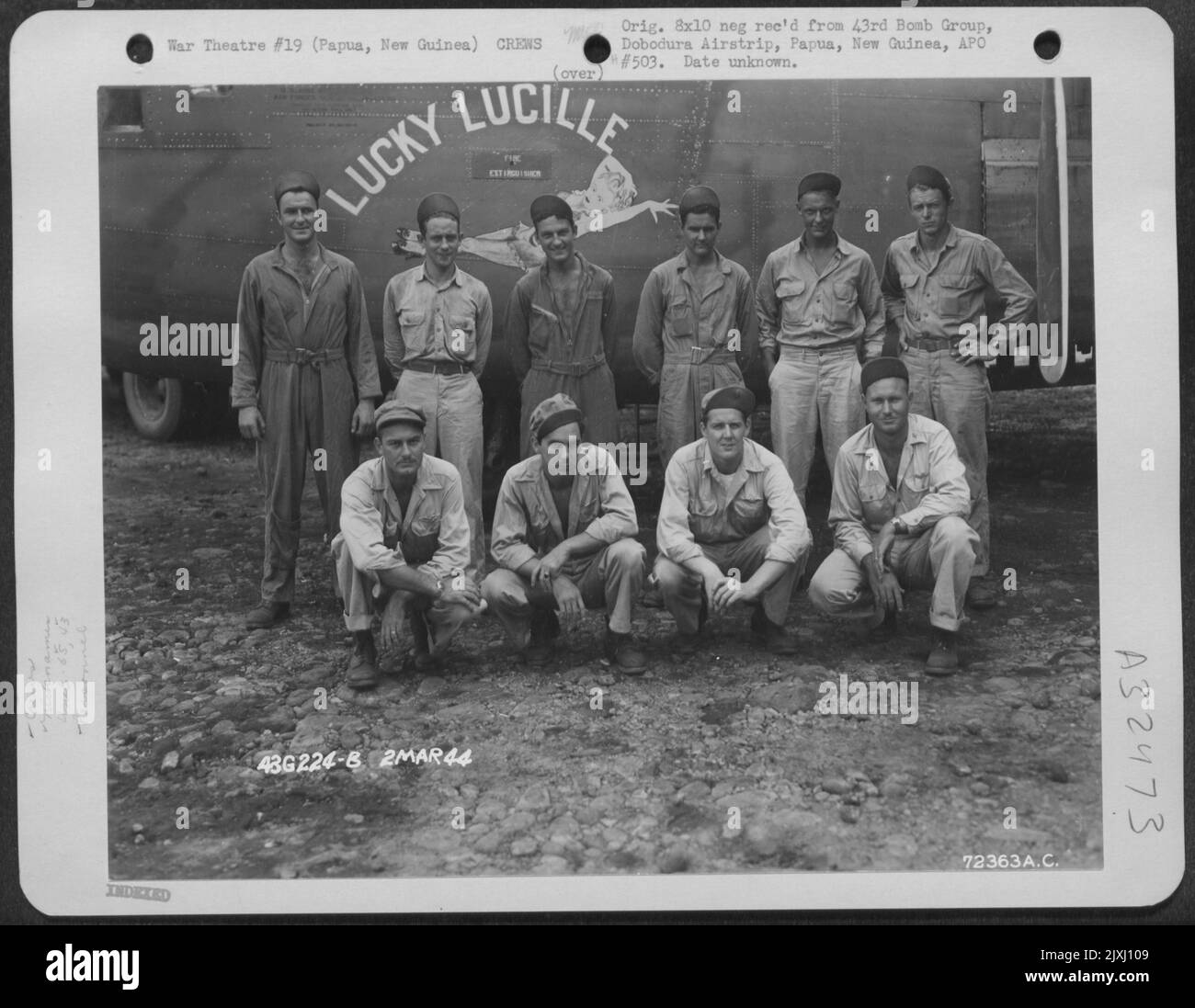 Lt. Casady And Crew Of The 65Th Bomb Squadron, 43Rd Bomb Group, Pose Beside The Consolidated B-24 'Lucky Lucille' At Dobodura Airstrip, Papua, New Guinea. 2 March 1944. Stock Photo