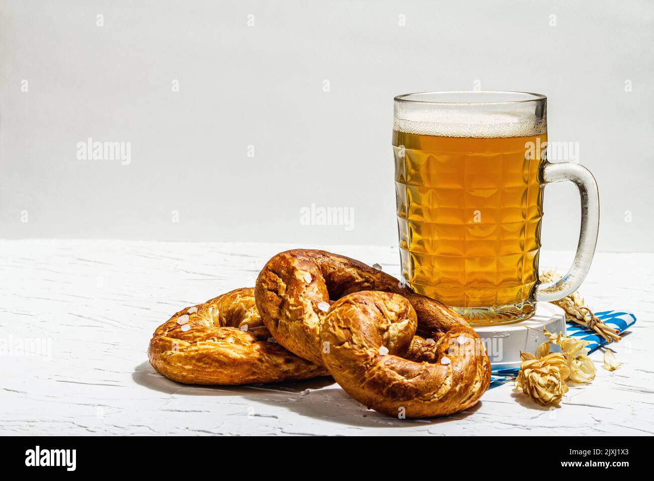 Traditional Oktoberfest set. Pretzels, beer, traditional pattern napkin