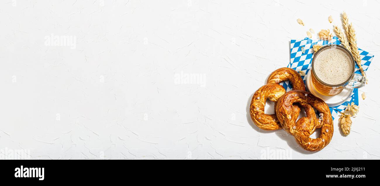 Traditional Oktoberfest set. Pretzels, beer, traditional pattern napkin