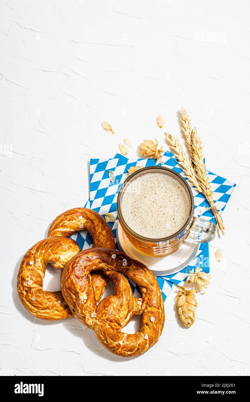 Traditional Oktoberfest set. Pretzels, beer, traditional pattern napkin