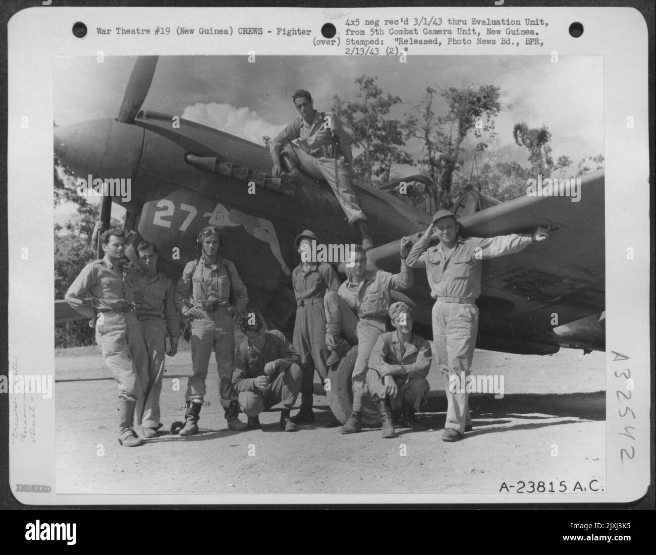 Members of the 49th Fighter Group pose beside a Curtiss P-40 at an air base in Buna, New Guinea. They are, left to right: Robert V. McHale Harry B. Dillworth Joe King Lucius D. LaCroix Arland Stanton Clyde Knisley Paul J. Slocum David Baker Stock Photo
