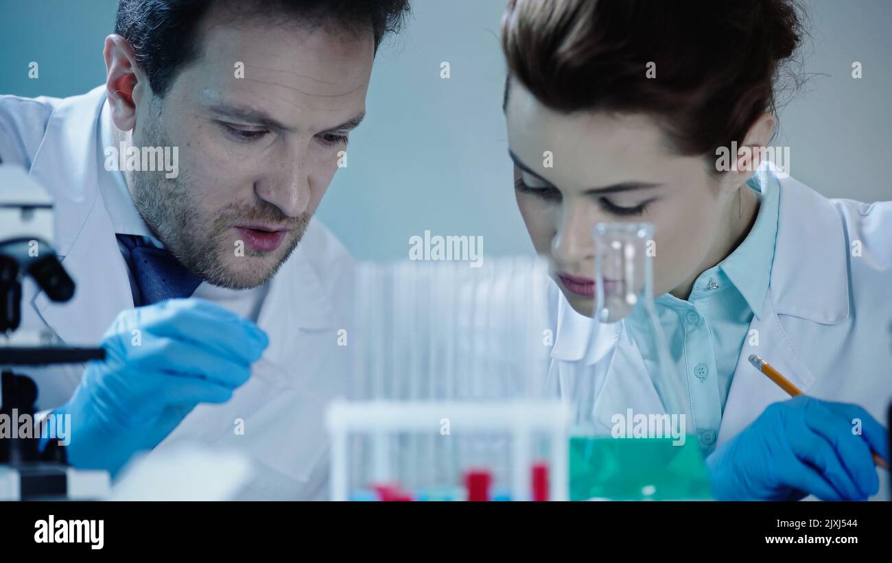 Two scientists in latex hi-res stock photography and images - Alamy