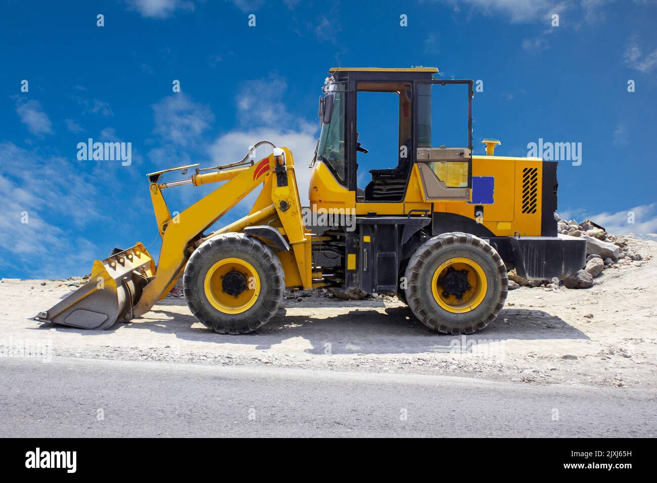excavator or backhoe on construction site and sky background Stock