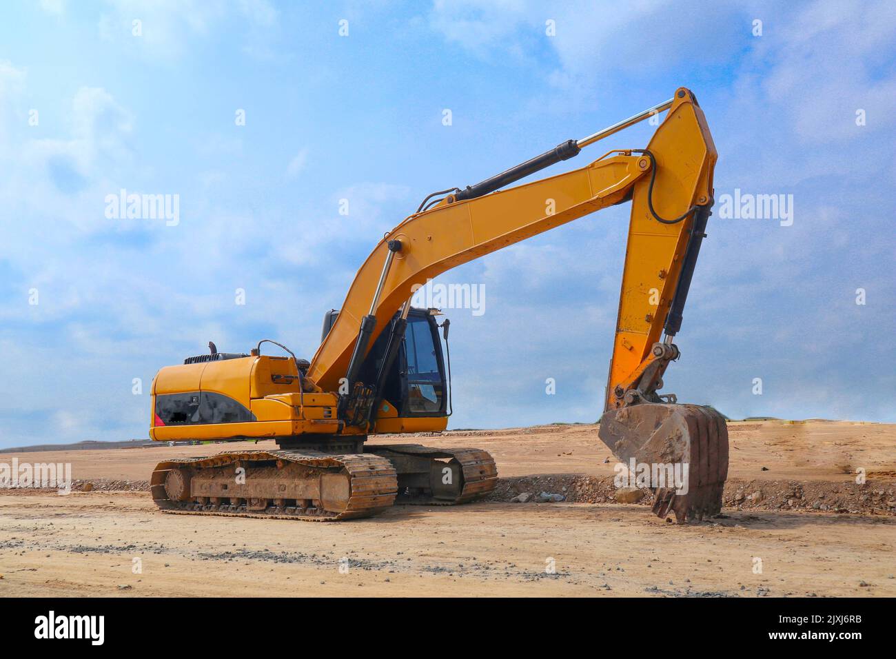 excavator or backhoe on construction site and sky background Stock