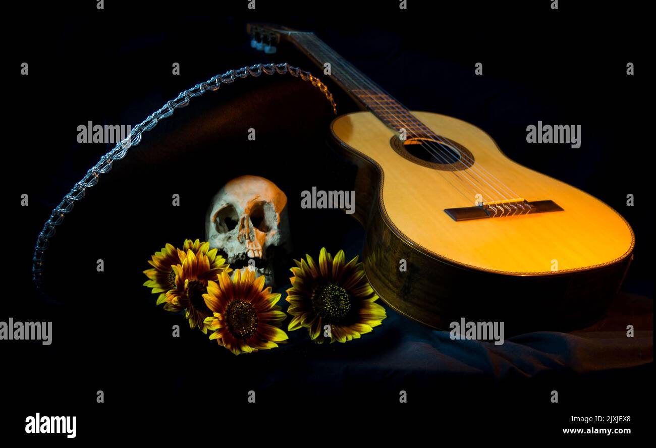 human skull, mexican hat, guitar and sunflowers for day of the dead Stock Photo