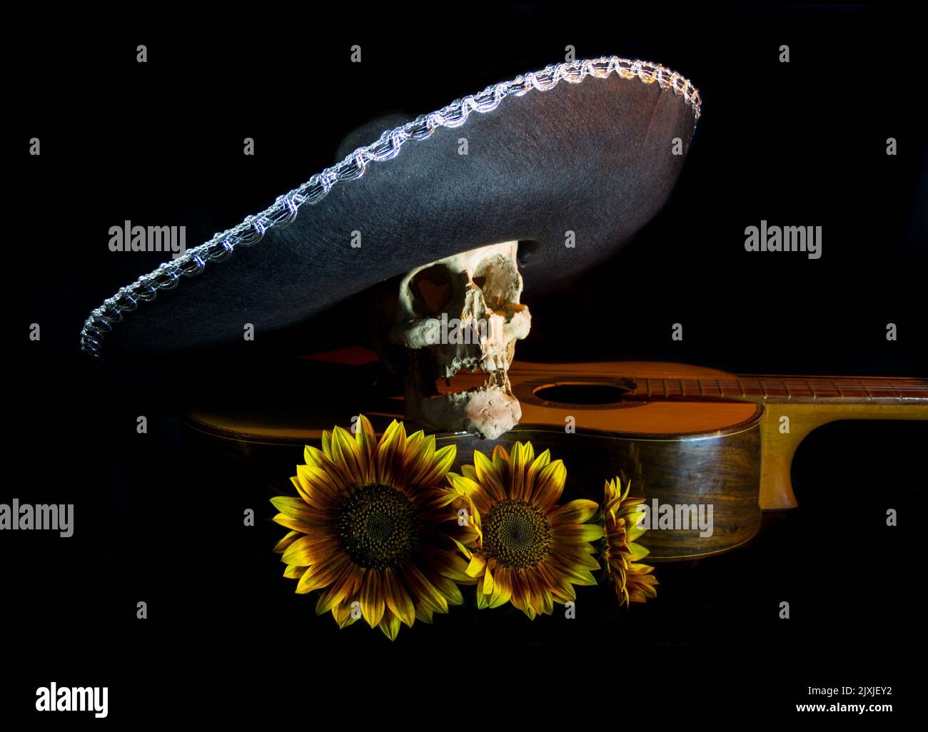 human skull, mexican hat, guitar and sunflowers for day of the dead Stock Photo