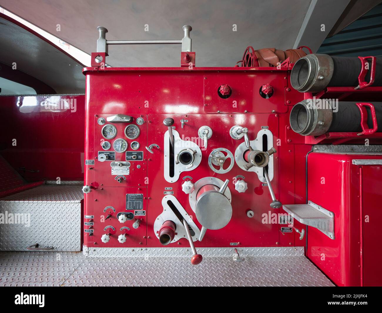 An old red fire truck with tools and equipment Stock Photo Alamy