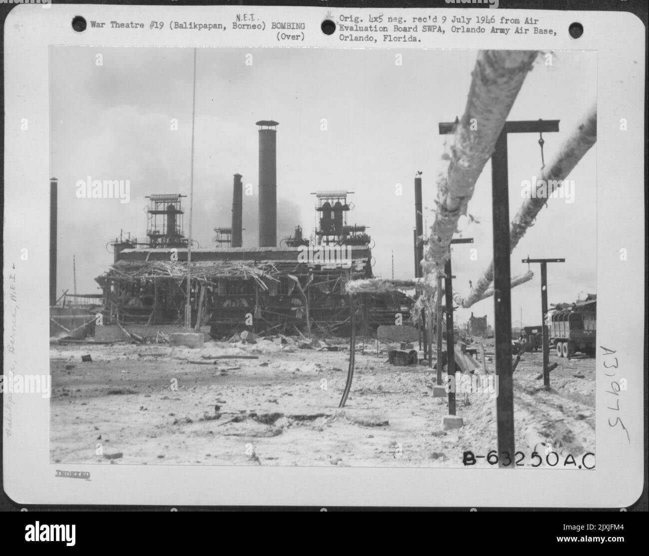 Balikpapan Operation July 1-31, 1945-Shown here is the gasoline cracking plant on Signal Hill, Balikpapan, which were destroyed by bombs and Naval shell fire. 5 July 1945. Stock Photo