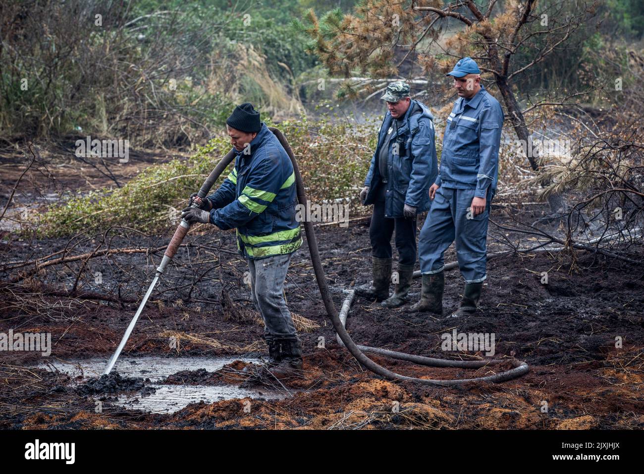 Polluted Bogs Firefighters put out a fire in a peat bog in the village of Sosnivka in ...
