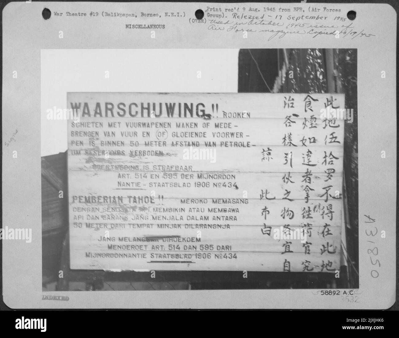 sign-in-front-of-a-fire-gutted-refinery-threatens-severe-punishment-in