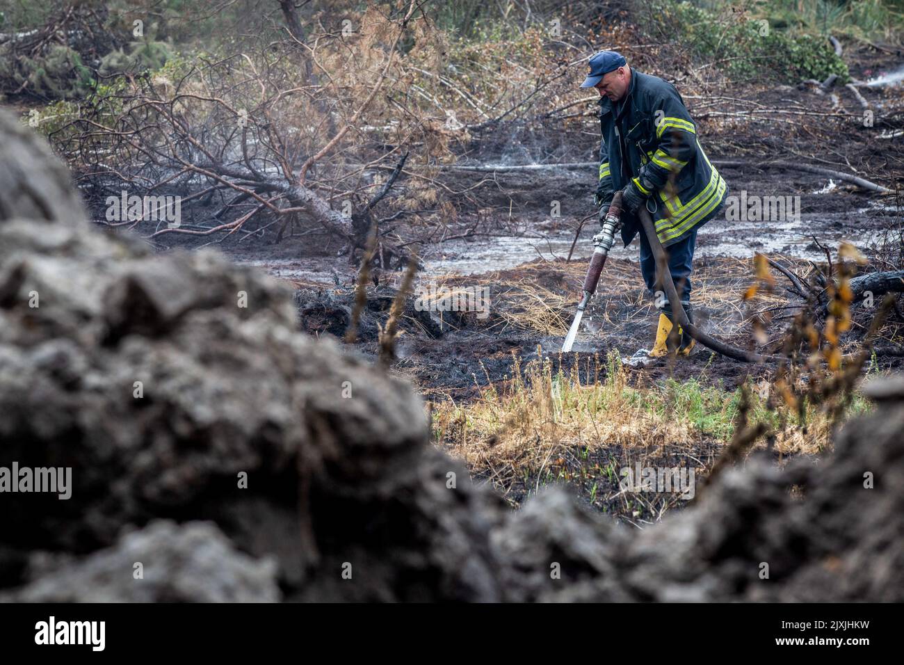 Polluted Bogs A firefighter puts out a fire in a peat bog in the village of Sosnivka ...