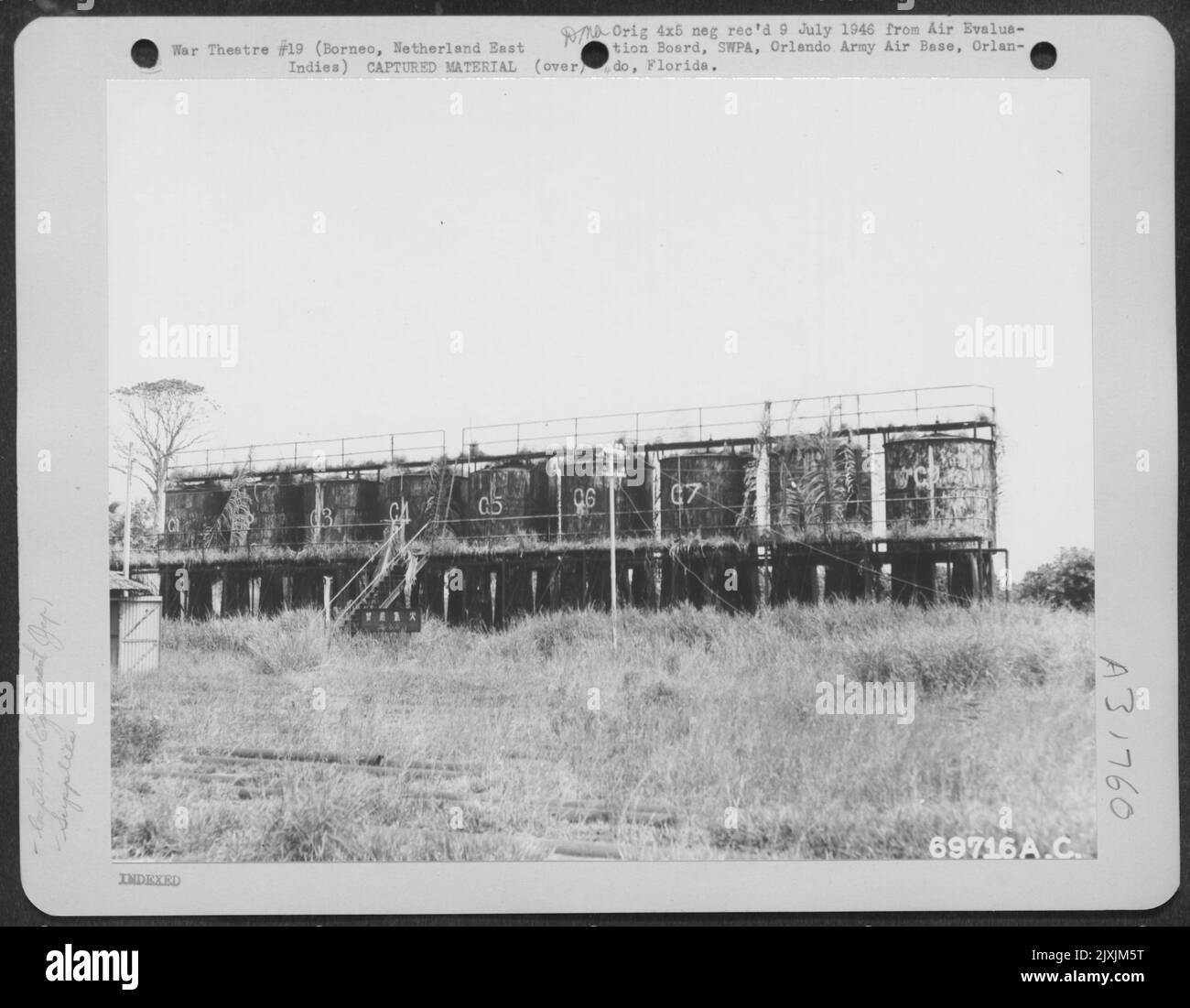 The Japaneseanese filled oil drums from these storage tanks at the