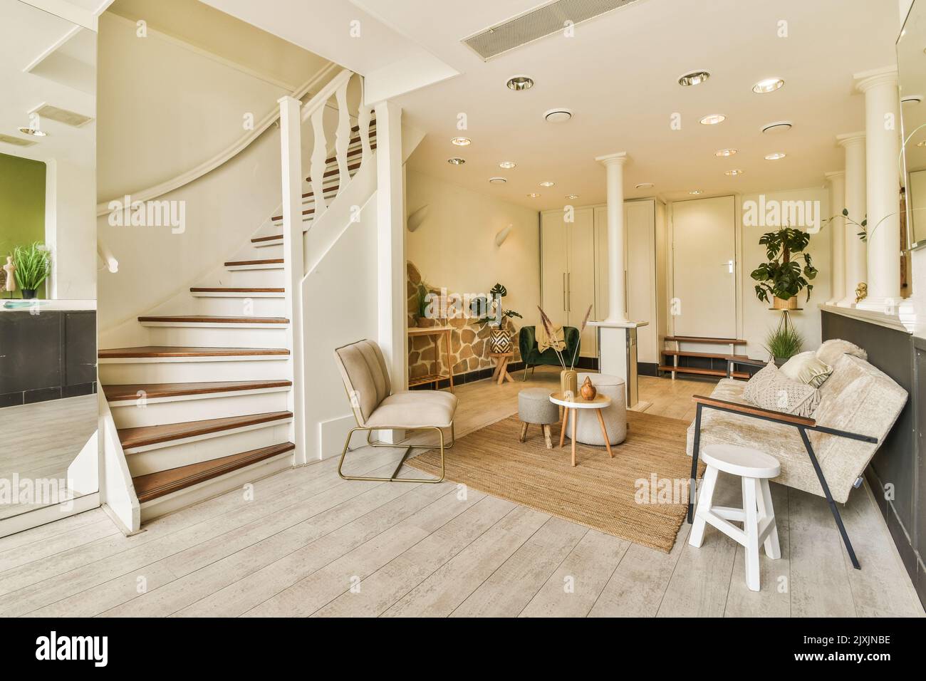 Modern apartment hall with staircase fence and open access to sitting ...