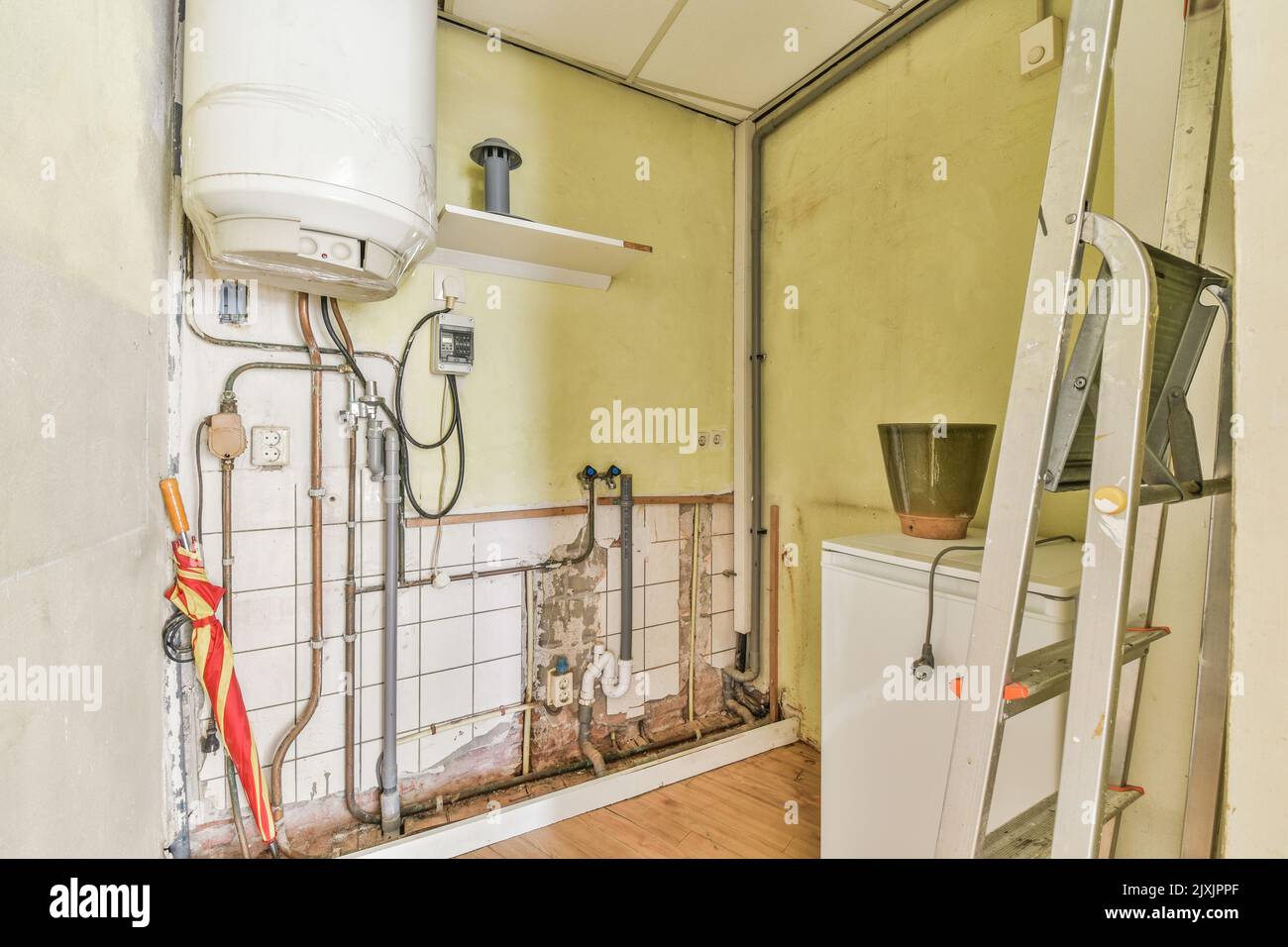 Boiler room of an apartment building with pipes and metering devices. A