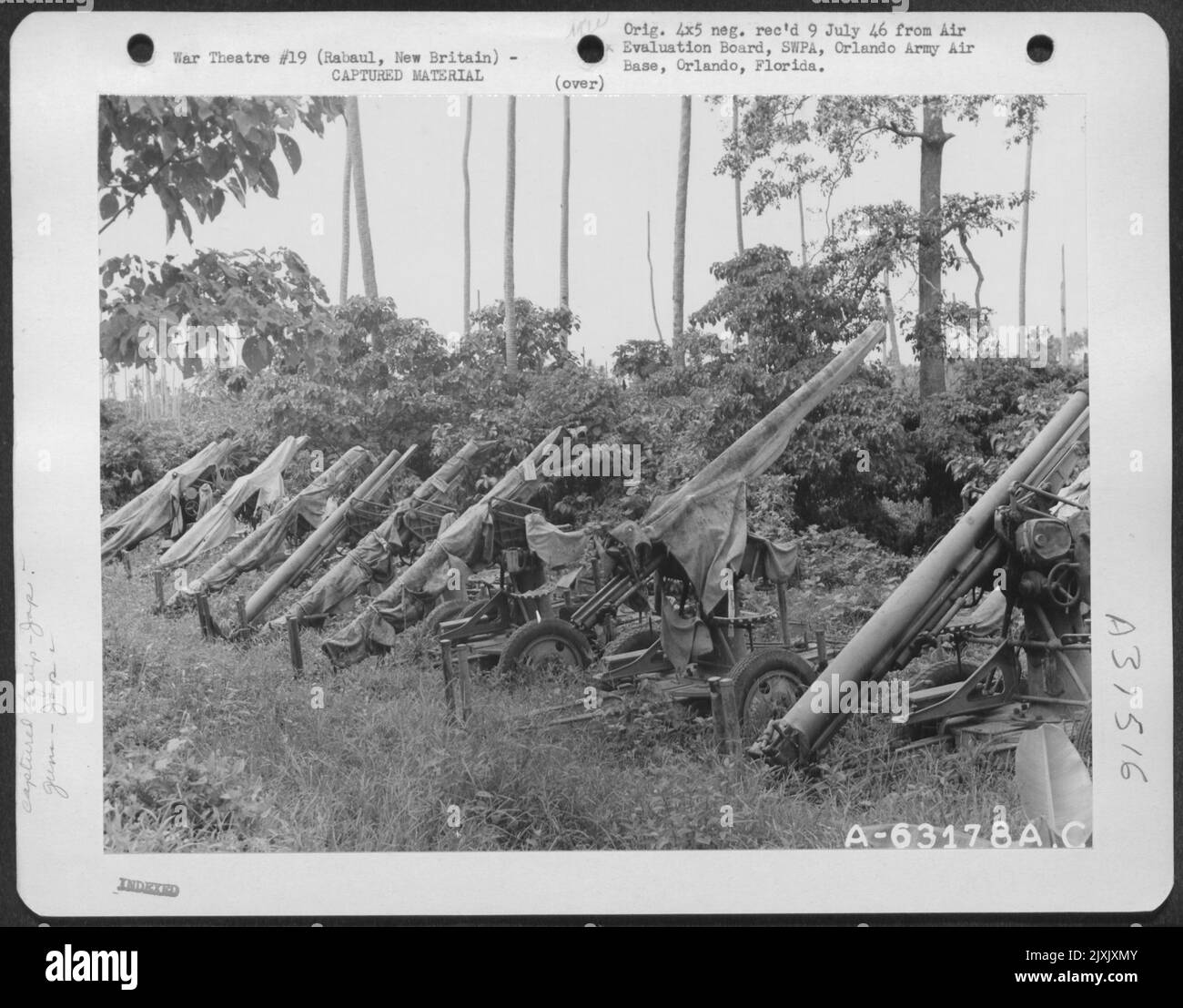 View showing Japaneseanese anti-aircraft guns type 88, 75 mm along Simpson Harbor, Rabaul, New Britain. 8 November 1945. Stock Photo