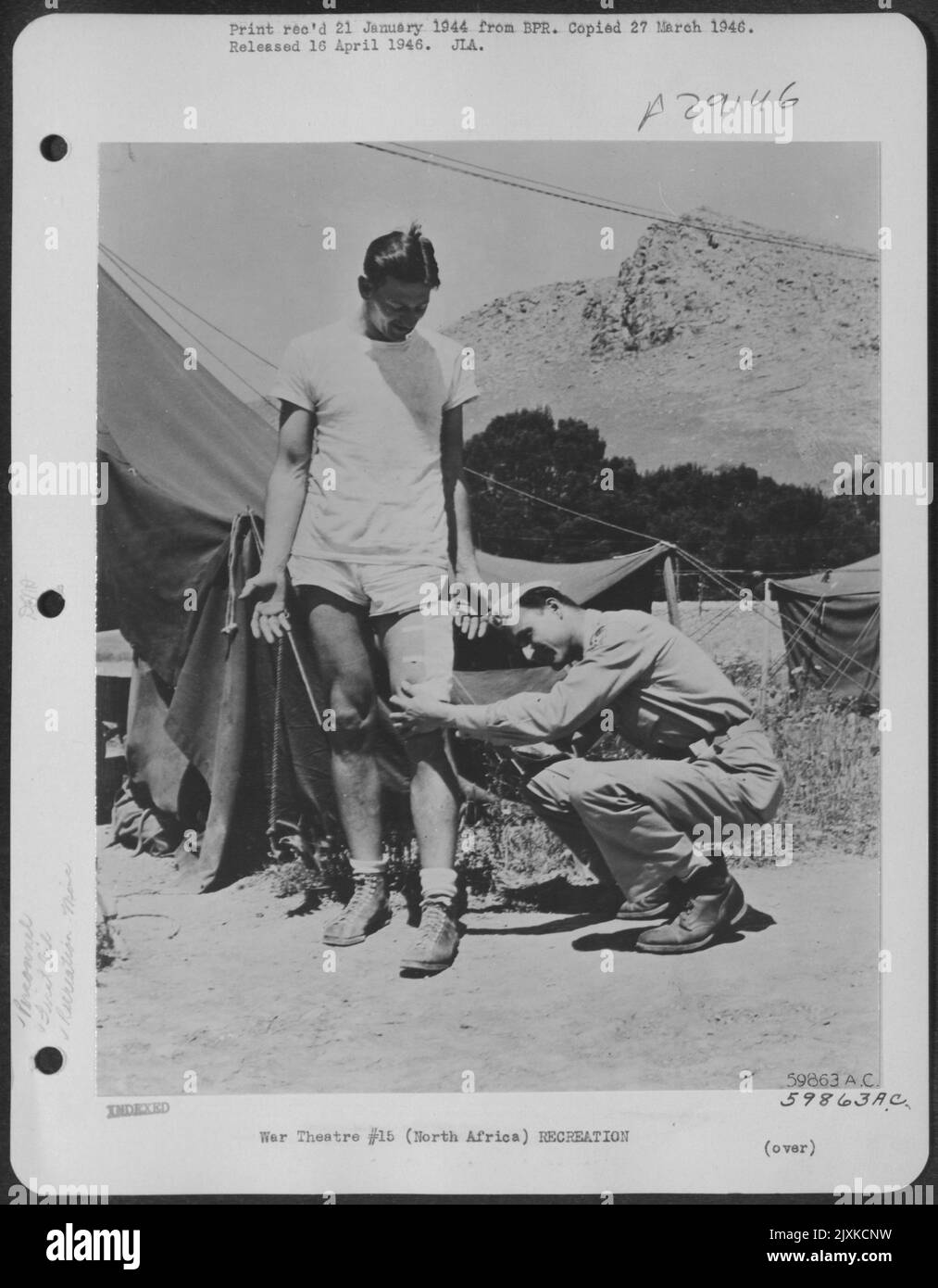 The 'I'll be damned' expression on the face of Capt. James Banks McFadden, Great Falls, S.C., an All-American halfback at Clemson in 1939, is understandable. Years of high school, college and professional football left him without a scratch but an Stock Photo