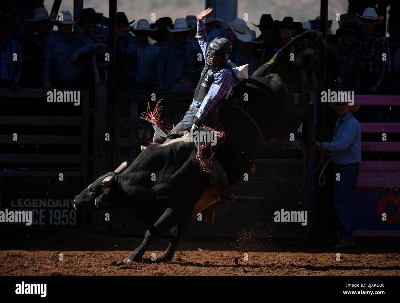 Jake Curr competes in the open bull ride event at the Mount Isa Mines ...