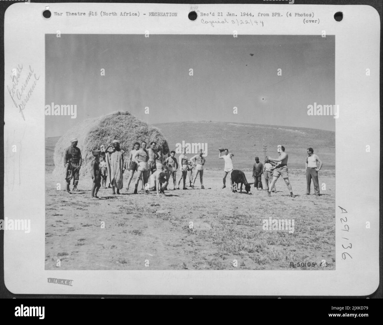 S/Sgt. William J. Collins, 422E Mt. Airy Ave., Philadelphia, Pa., is set to go out for a pass from Capt. James Banks McFadden, Great Falls, S.C., former Clemson College All-American halfback. This scene was taken in North Africa where members of the Stock Photo