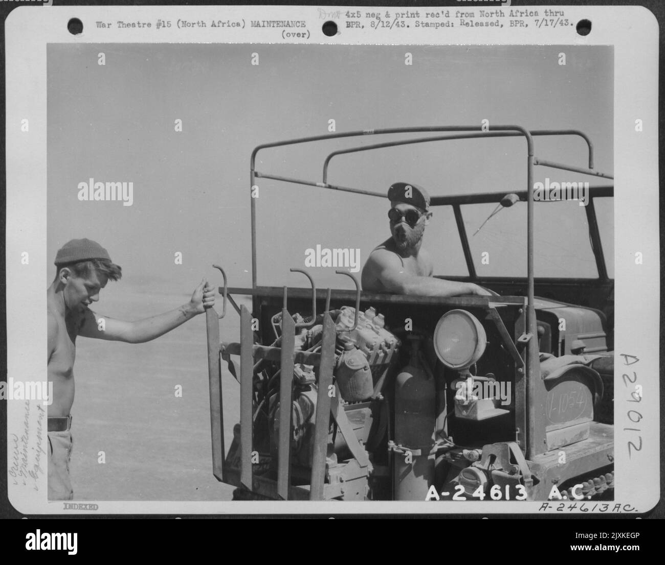 North Africa-Cle-trac driver, with dust respirator on, waiting to pull ...