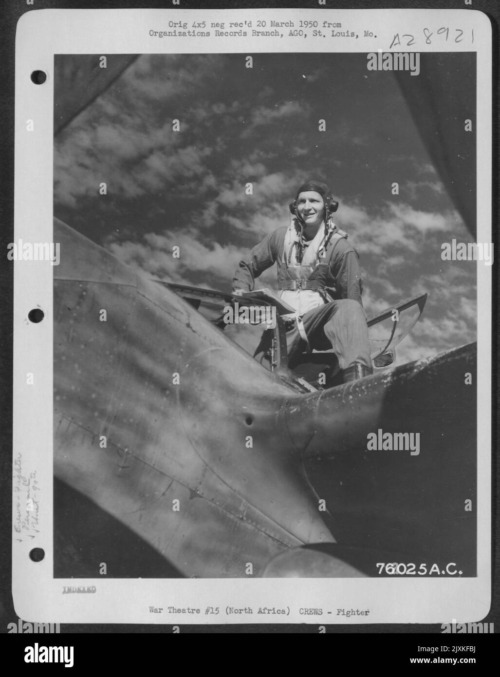 Lt. Tunnel, pilot of the 90th Photographic Reconnaissance Wing, steps