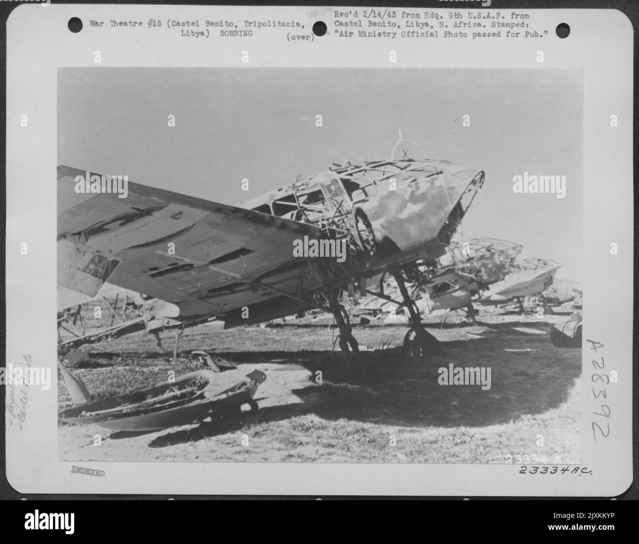A line of burned out enemy airplanes on the airfield at Castel Benito, near Tripoli, Tripolitania, Libya. 26 January 1943. Stock Photo