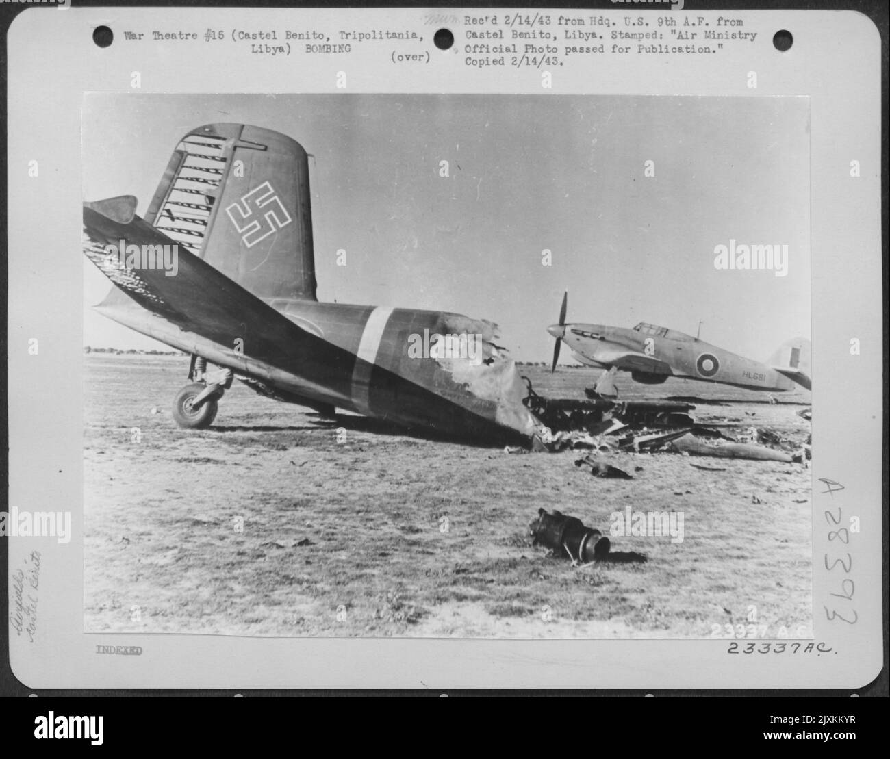 A Hurricane fighter ready to take off from the landing ground at Castel Benito, Tripolitania, Libya. In the foreground is the wreck of a Focke-Wulf 'Condor.' 26 January 1943. Stock Photo