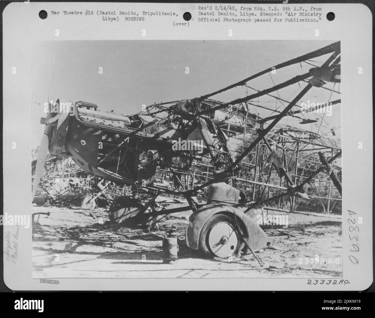 The burned out frame of an Italian Caproni monoplane on the airfield at Castel Benito near Tripoli, Tripolitania, Libya. 26 January 1943. Stock Photo