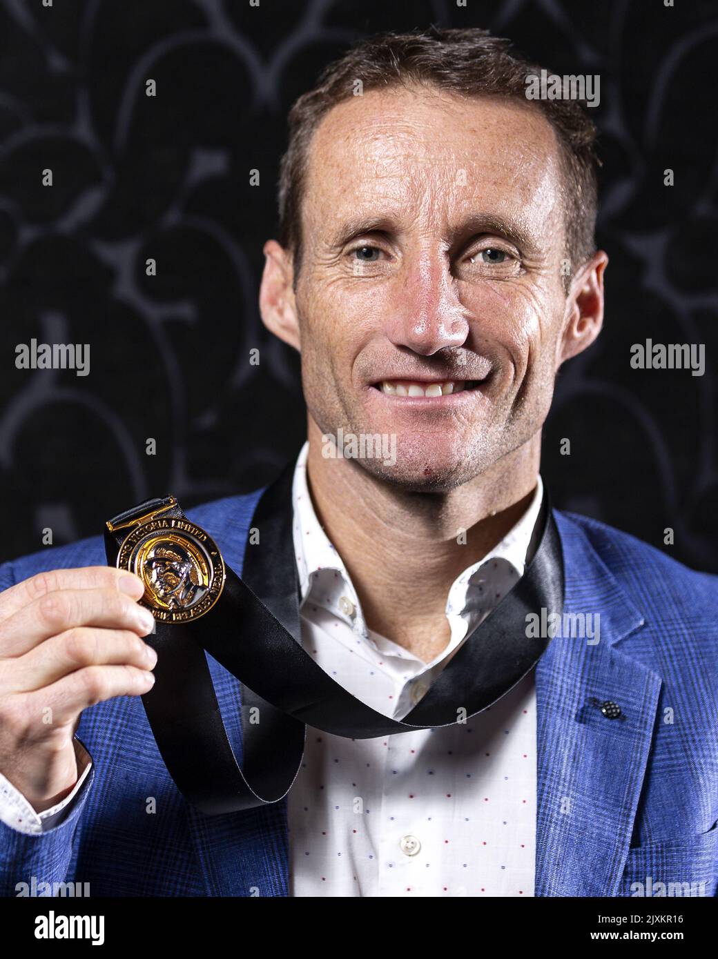 Damien Oliver poses for a photograph with the Scobie Breasley Medal
