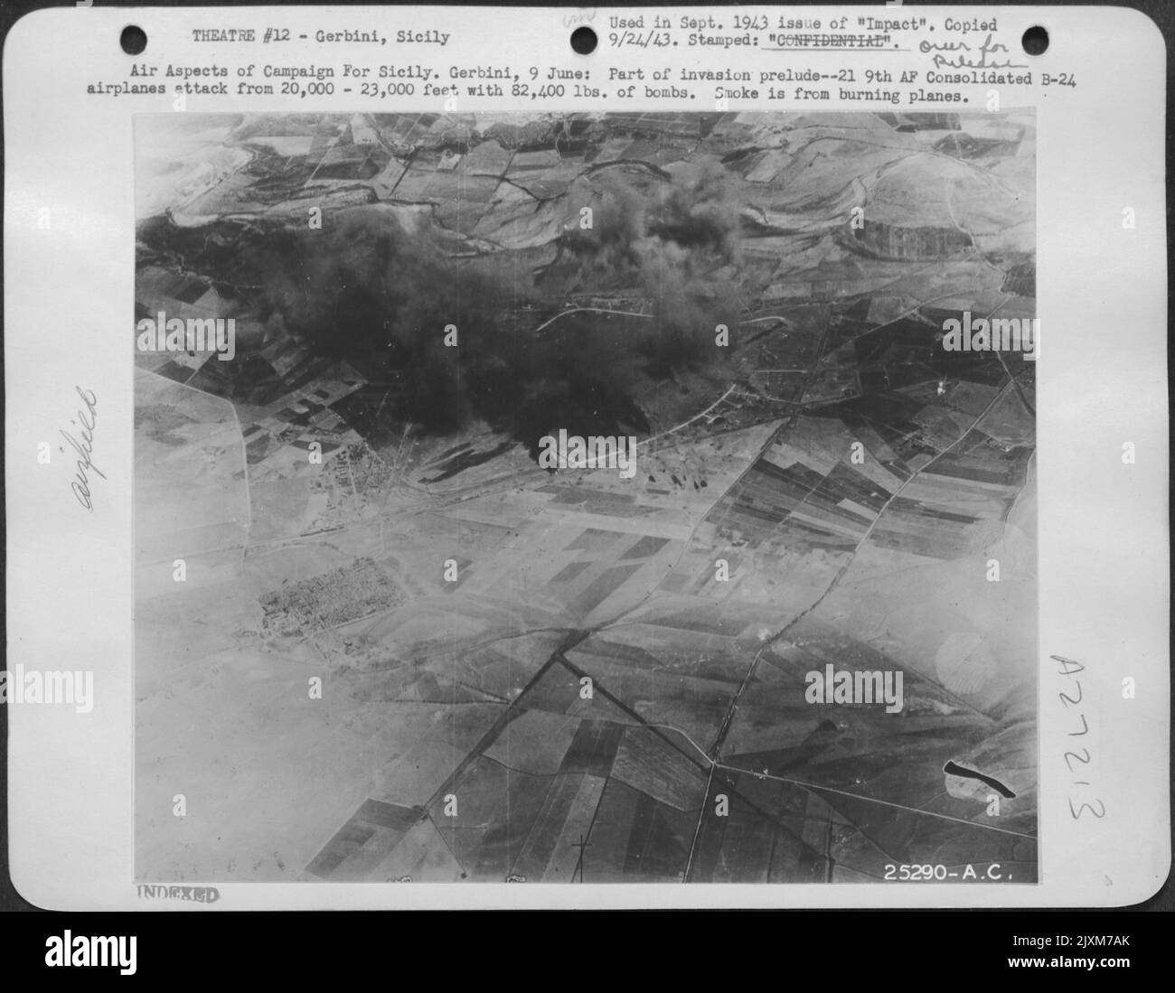 Air Aspects of Campaign For Sicily. Gerbini, 9 June: Part of invasion prelude--21 9th AF Consolidated B-24 airplanes attack from 20,000-23,000 feet with 82,400 lbs. of bombs. Smoke is from burning planes. Stock Photo