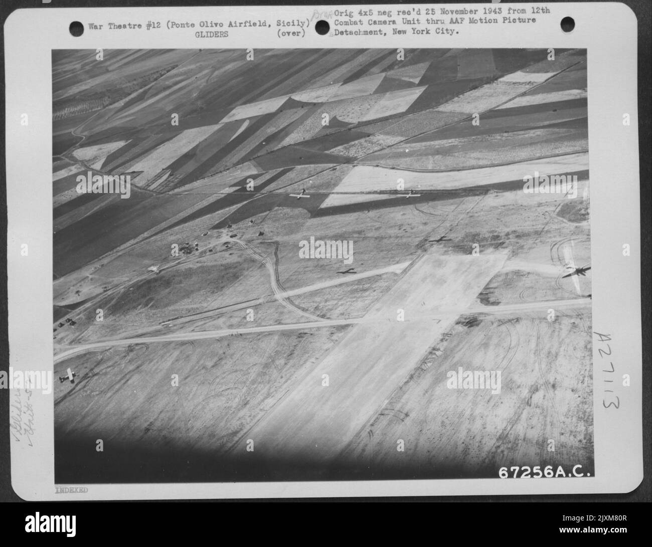 Two gliders of the 52nd Troop Carrier Wing prepare to land beside the