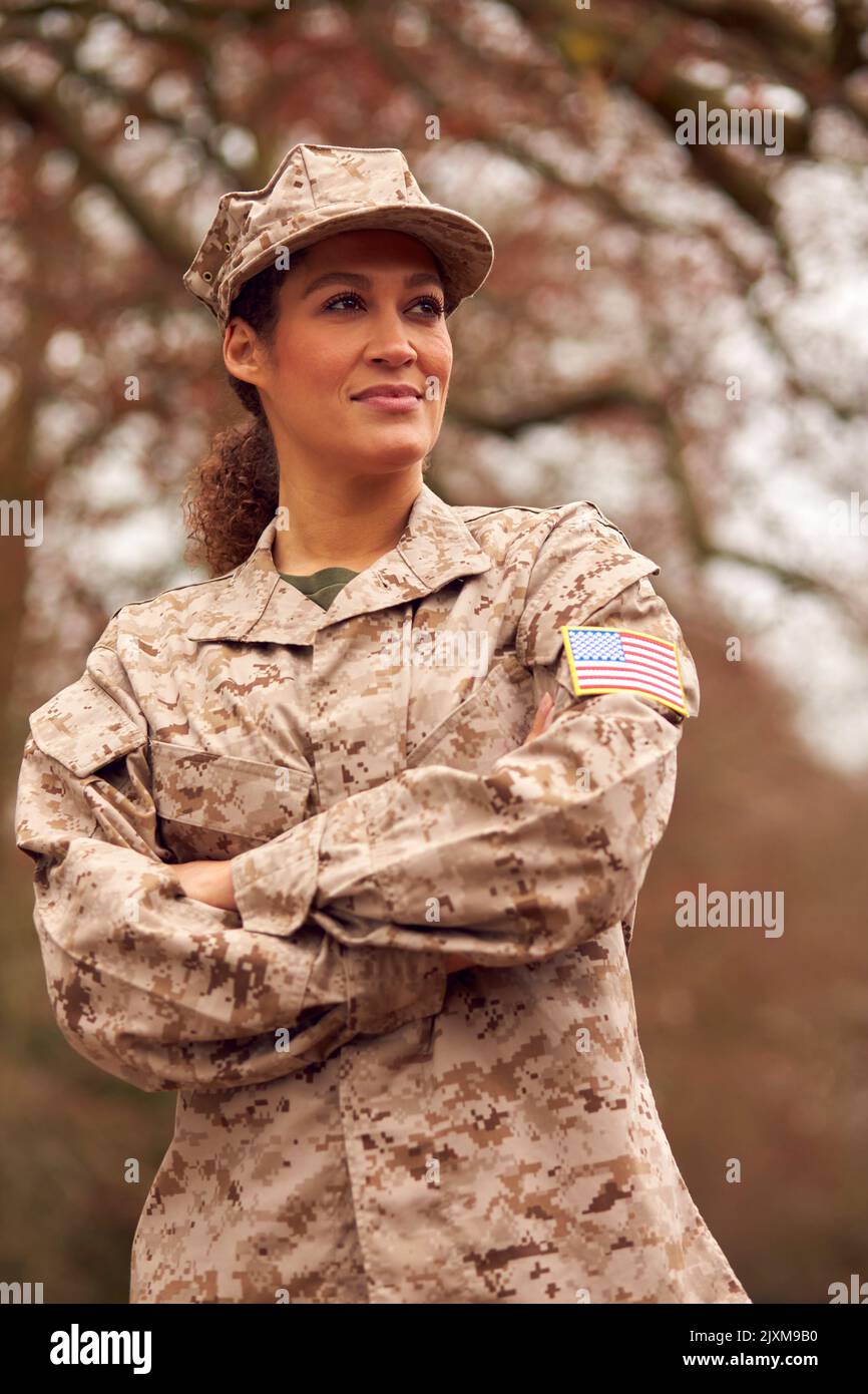 Portrait Of American Female Soldier In Uniform Returning Home On Leave Stock Photo