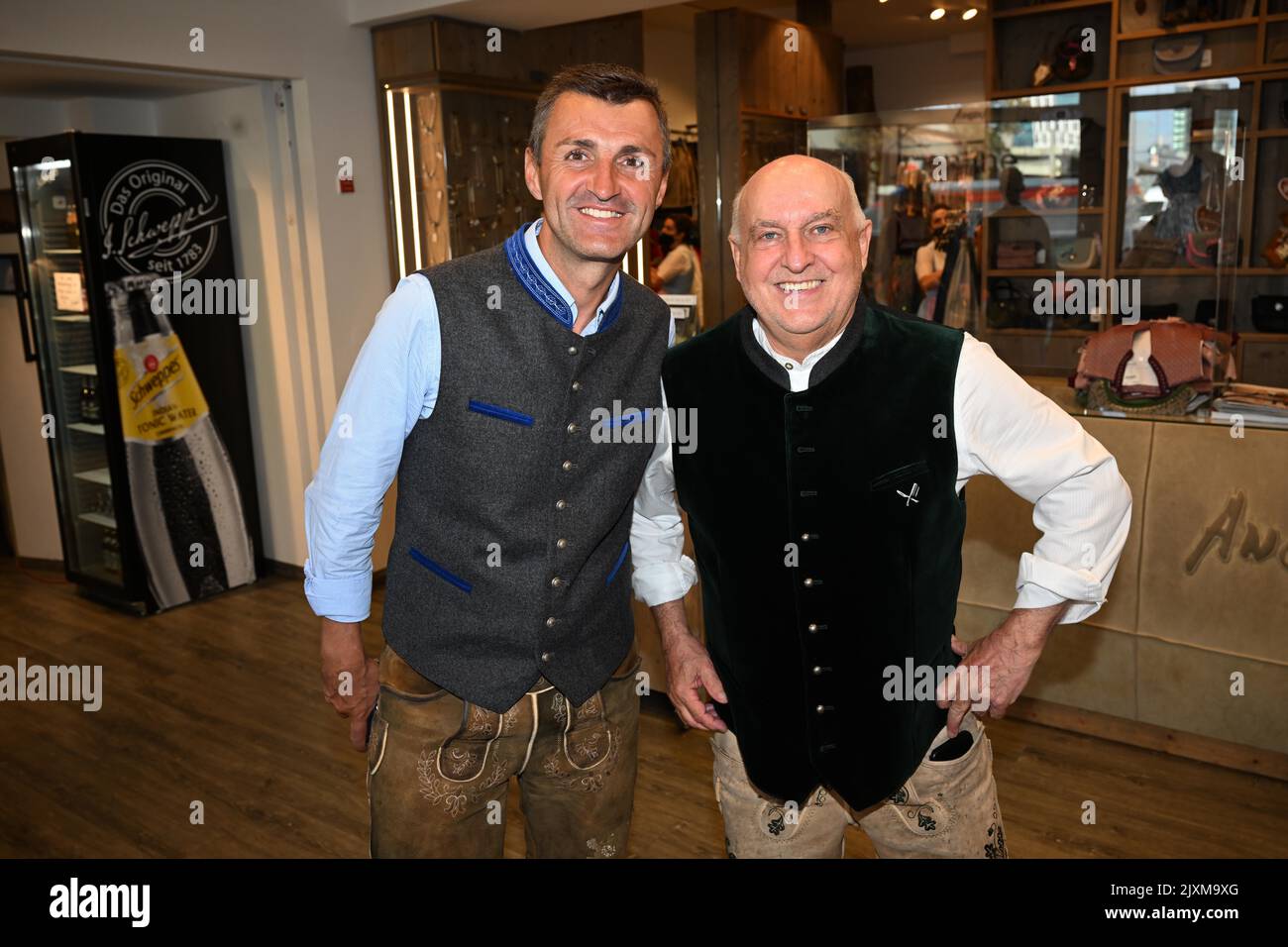Munich, Germany. 07th Sep, 2022. The coach of Fußballverein 1860 Michael Köllner (l) and the managing director of Trachten Angermaier, Axel Munz show off the Löwen's Wiesn uniform at Angermaier Trachten. Traditionally, the players of the soccer club 1860 are equipped with lederhosen and traditional costumes for the Oktoberfest season. Credit: Felix Hörhager/dpa/Alamy Live News Stock Photo
