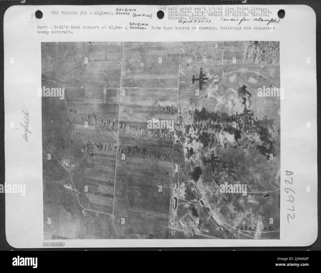 Martin B-26's Bomb Airport at Alghero, Sardinia. Note bomb bursts on runways, buildings and dispersed enemy aircraft. Stock Photo