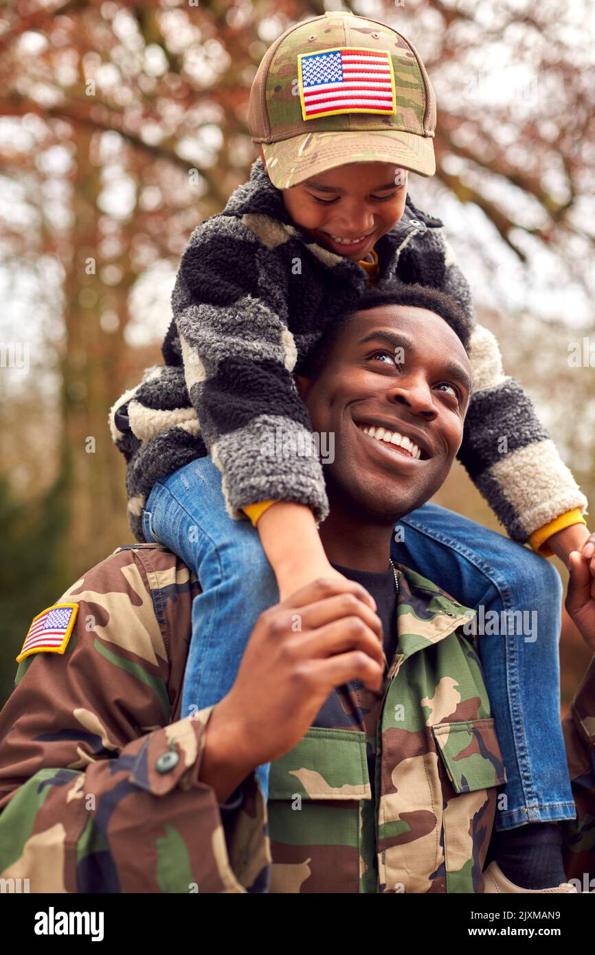 American Soldier In Uniform Returning Home To Family On Leave Carrying