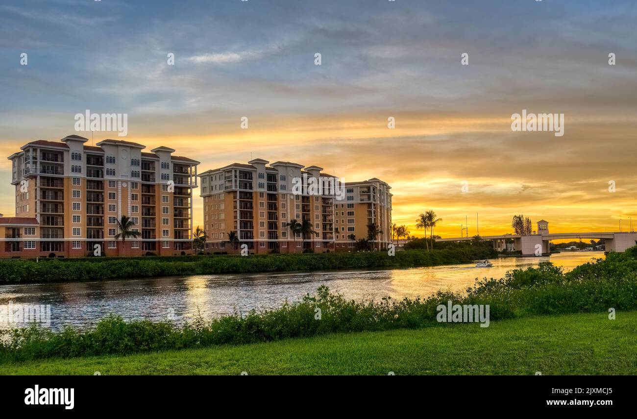 Sunset sky behind buildings along the Gulf Intercoastal Waterway in Venice Florida USA Stock Photo